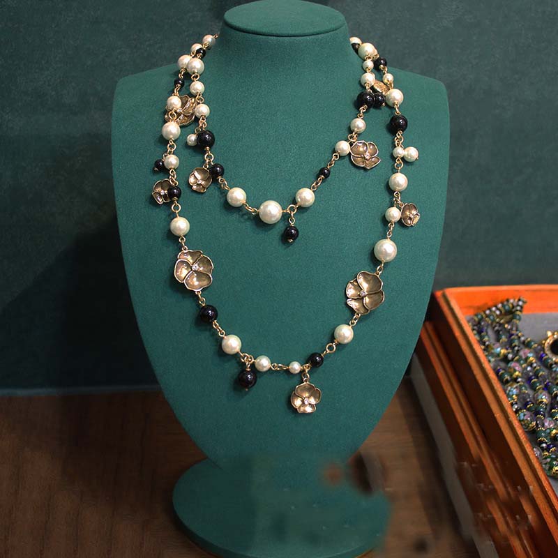 Autumn and winter imitation pearl sweater chain long multi-layer black glass necklace four-leaf clover handmade enamel necklace
